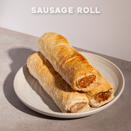 Two sausage rolls on a plate with 'Bourkies Bakehouse' branding.